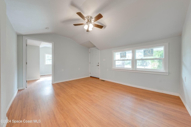 bonus room featuring ceiling fan, vaulted ceiling, and light wood-type flooring