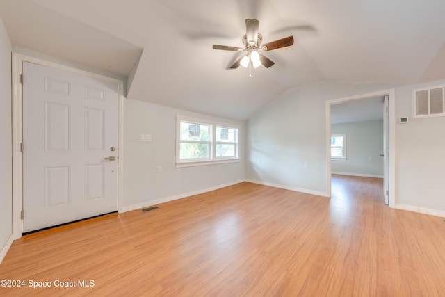 interior space with ceiling fan, light hardwood / wood-style flooring, and vaulted ceiling