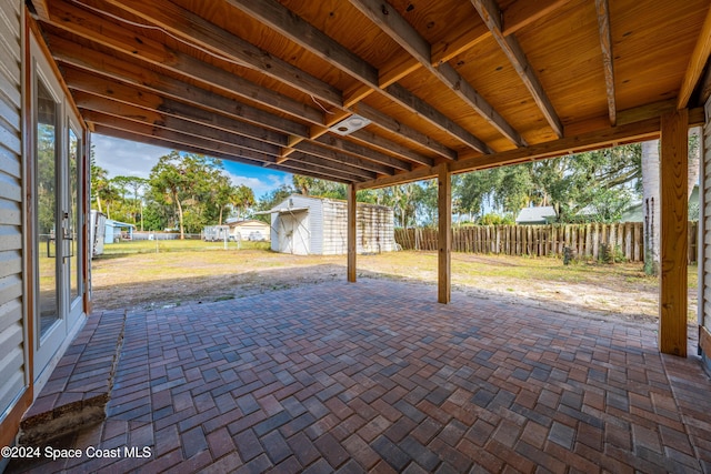 view of patio / terrace with a storage shed