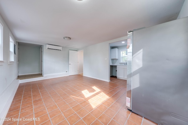 tiled empty room with a wall unit AC