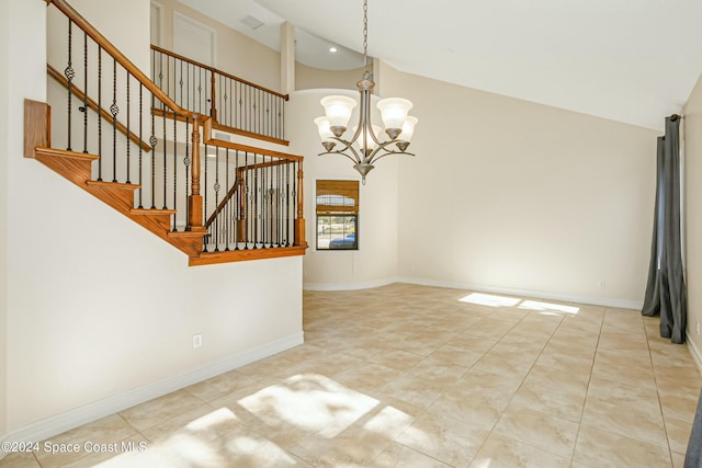 interior space with high vaulted ceiling and an inviting chandelier