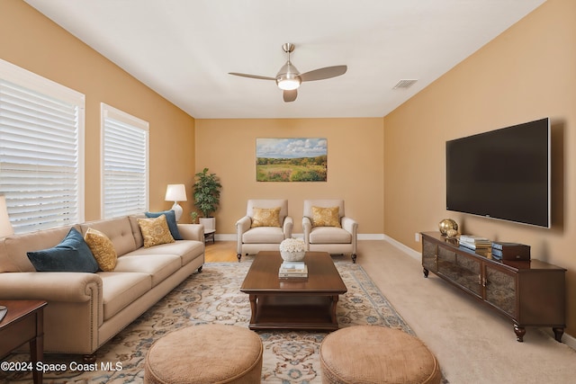 living room with ceiling fan and light carpet