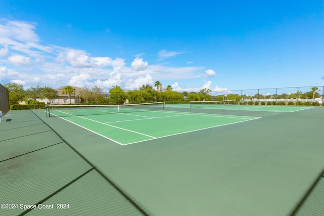 view of tennis court featuring basketball court