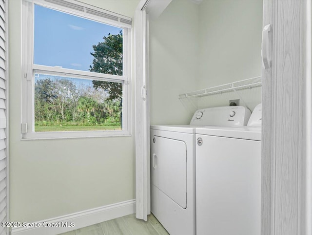 washroom featuring washing machine and dryer