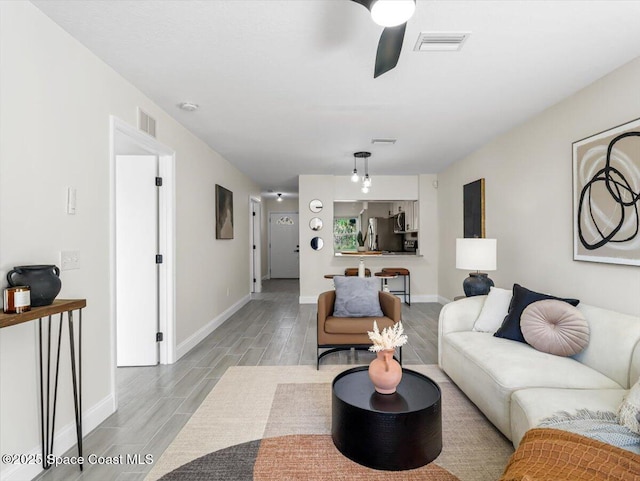 living room with ceiling fan