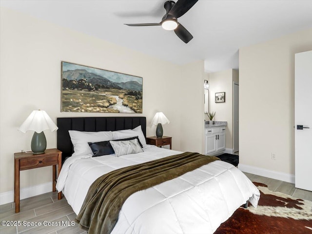 bedroom featuring ensuite bathroom and ceiling fan