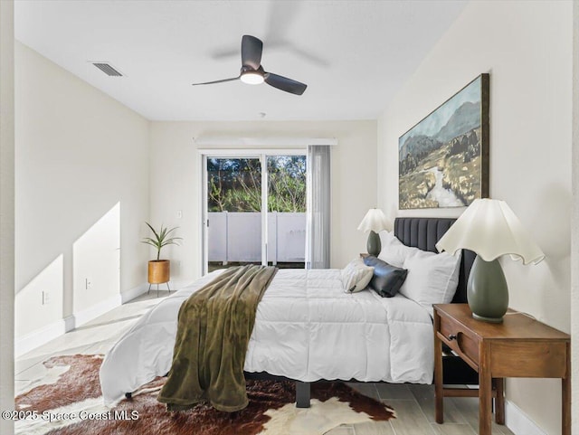 bedroom with access to exterior and ceiling fan