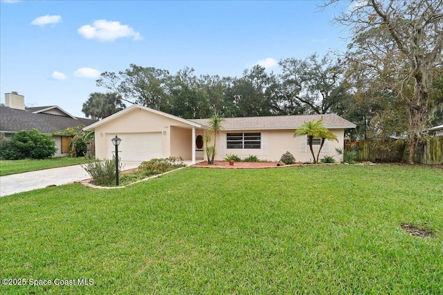 ranch-style home featuring a garage and a front lawn