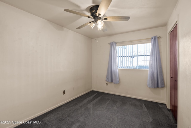 carpeted empty room with ceiling fan