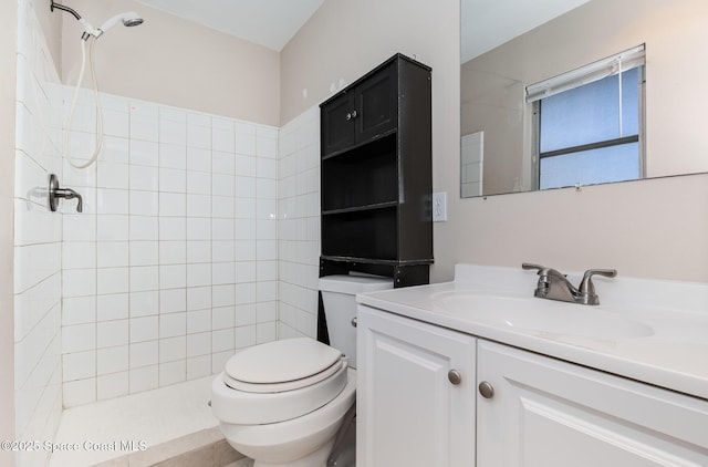 bathroom with vanity, toilet, and walk in shower