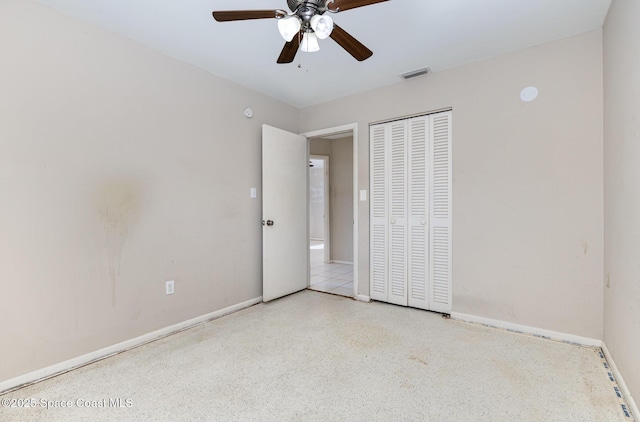 unfurnished bedroom with a closet and ceiling fan