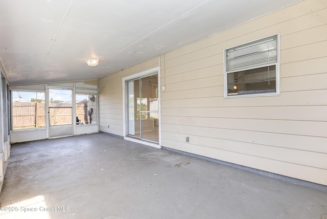 unfurnished sunroom with plenty of natural light and lofted ceiling