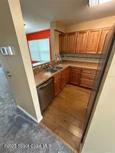 kitchen with stainless steel dishwasher and sink