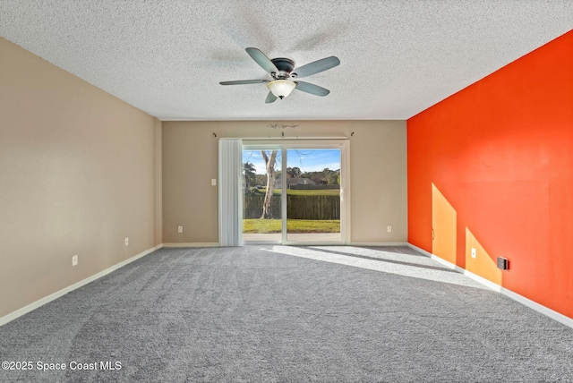 empty room featuring carpet floors, a textured ceiling, and ceiling fan