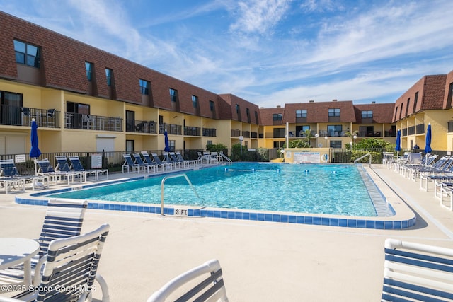 view of swimming pool with a patio