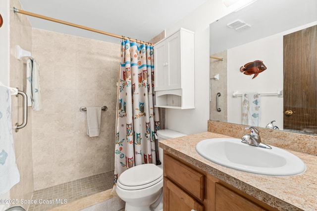 bathroom featuring toilet, vanity, and walk in shower