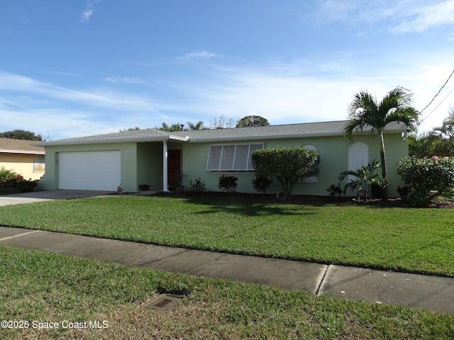 single story home featuring a garage and a front yard