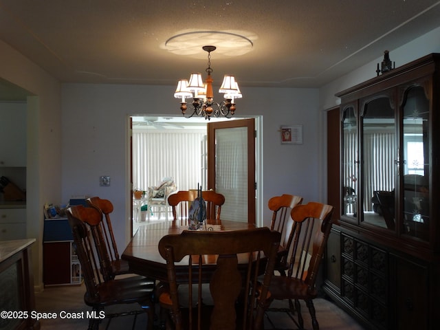 dining area featuring a chandelier