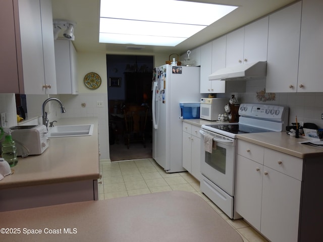 kitchen featuring white cabinetry, white appliances, sink, and tasteful backsplash