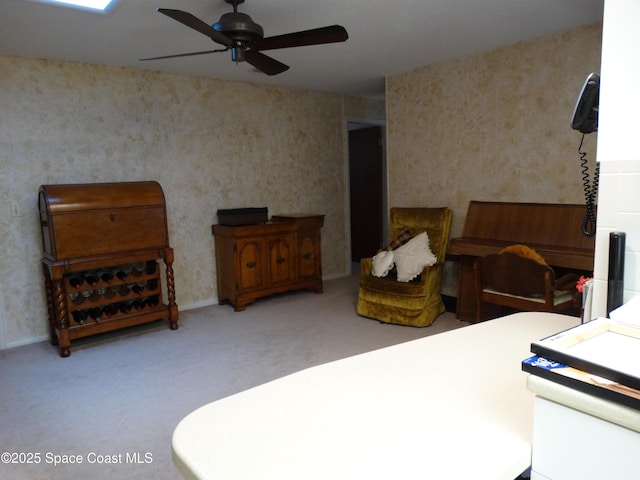 bedroom featuring ceiling fan and carpet