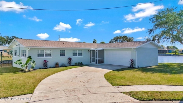 ranch-style home with a front yard and a garage