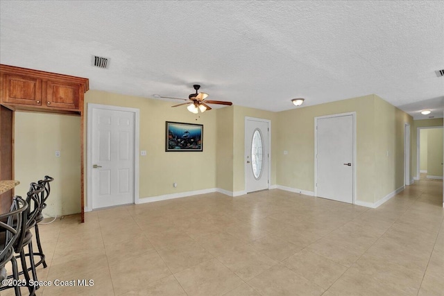 interior space featuring ceiling fan