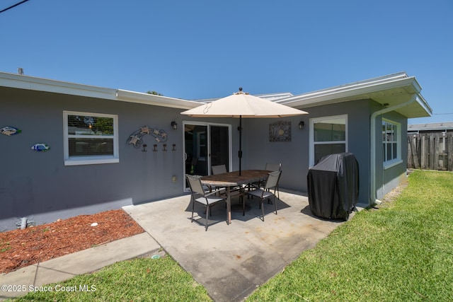 346 Cyprus Dr, Cocoa Beach, FL 32931 - rear view of property featuring a patio area and stucco siding
