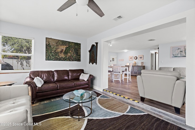 346 Cyprus Dr, Cocoa Beach, FL 32931 - living area featuring wood finished floors and a ceiling fan
