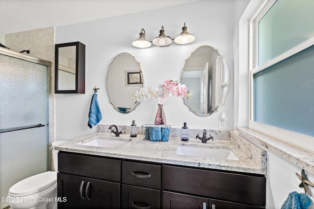 346 Cyprus Dr, Cocoa Beach, FL 32931 - bathroom featuring double vanity, a shower stall, and healthy amount of natural light