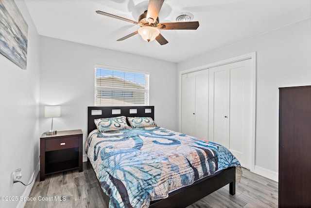 346 Cyprus Dr, Cocoa Beach, FL 32931 - bedroom with wood finished floors, a closet, and ceiling fan