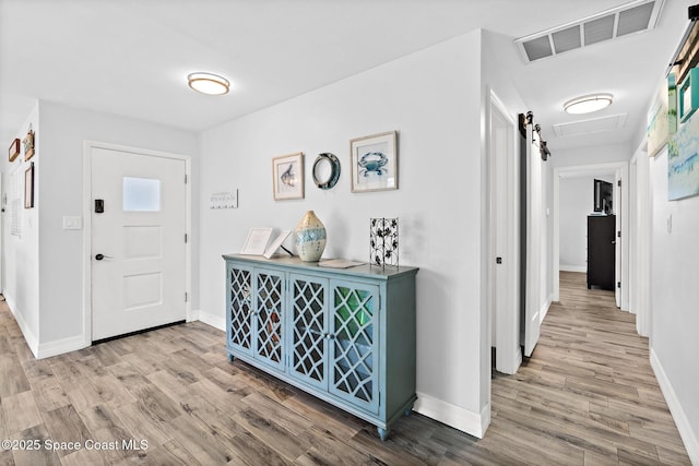 346 Cyprus Dr, Cocoa Beach, FL 32931 - entrance foyer with wood finished floors