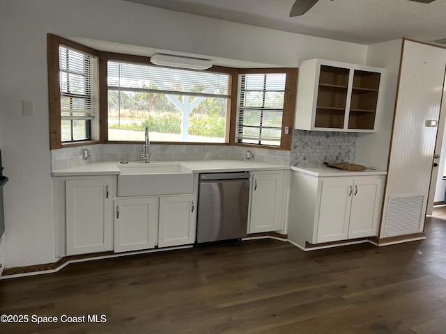 kitchen with stainless steel dishwasher, ceiling fan, sink, dark hardwood / wood-style floors, and white cabinetry