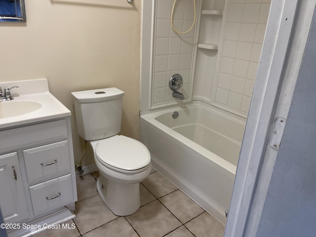 full bathroom featuring tile patterned floors, vanity, toilet, and tiled shower / bath