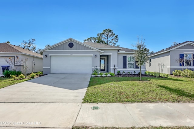 single story home featuring a front yard and a garage