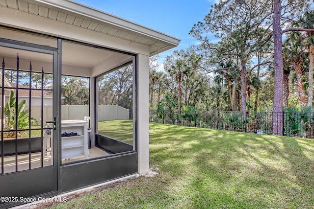 view of yard with a sunroom