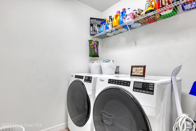 laundry area featuring washing machine and clothes dryer