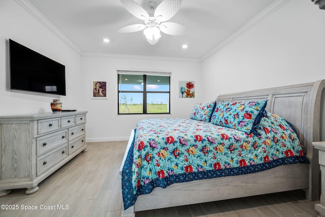 bedroom featuring ceiling fan, light wood-type flooring, and ornamental molding