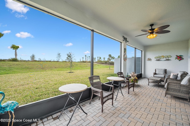 sunroom / solarium with ceiling fan