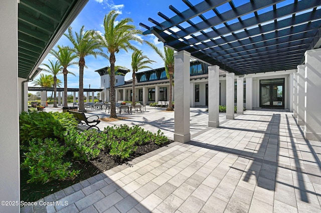 view of patio with a pergola and french doors