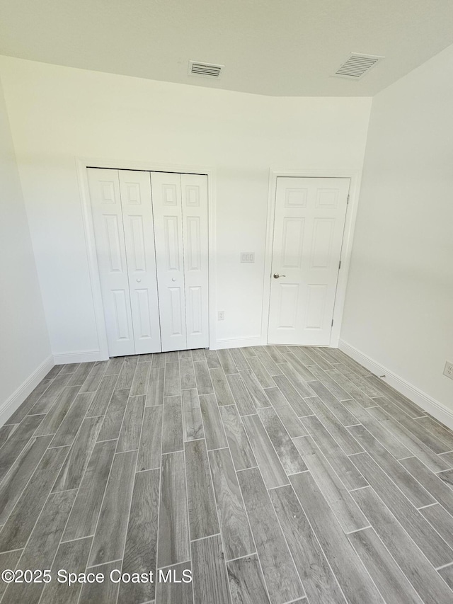 unfurnished bedroom with a closet