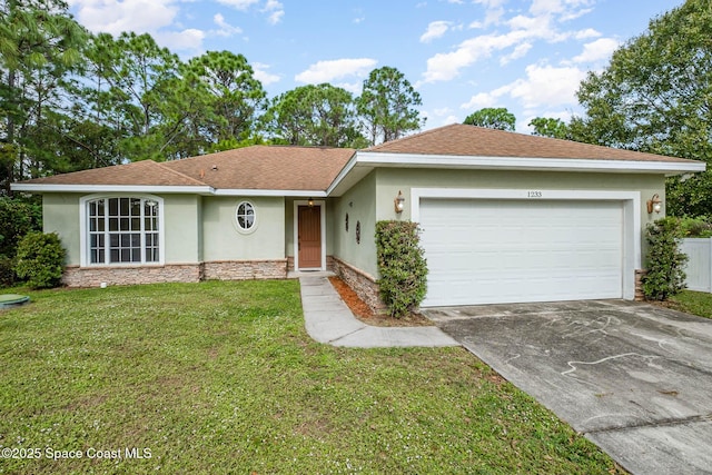 single story home featuring a front yard and a garage