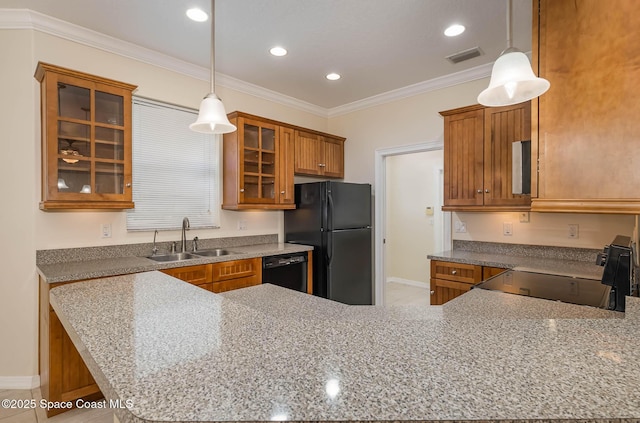 kitchen with kitchen peninsula, crown molding, black appliances, sink, and pendant lighting