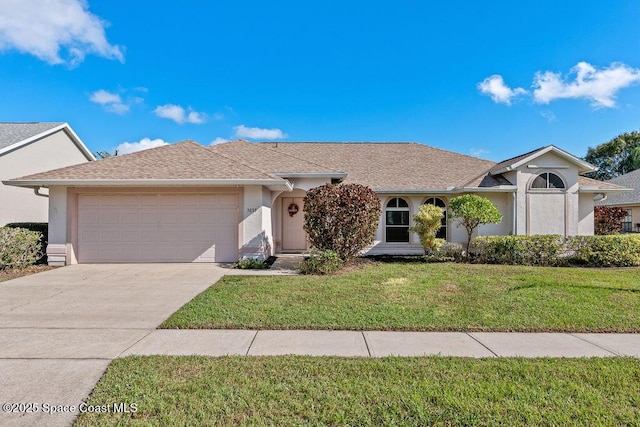 ranch-style house with a front yard and a garage