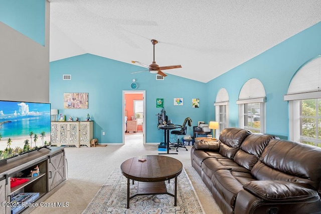 living room with a textured ceiling, ceiling fan, lofted ceiling, and light carpet