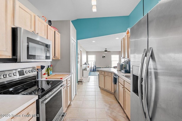 kitchen with ceiling fan, light tile patterned floors, light brown cabinetry, and appliances with stainless steel finishes