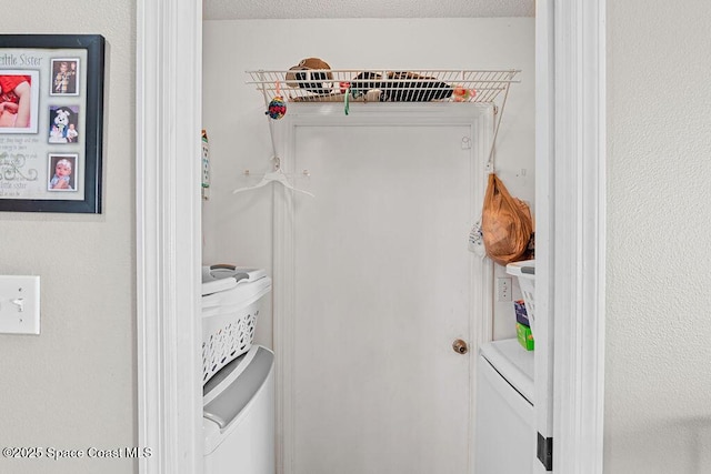 laundry area featuring a textured ceiling