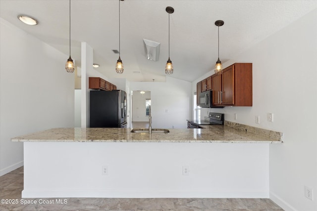 kitchen featuring kitchen peninsula, appliances with stainless steel finishes, and vaulted ceiling