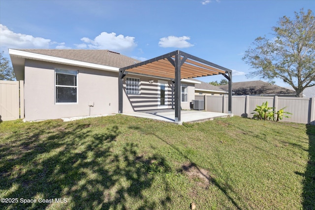 back of house with a yard, a pergola, cooling unit, and a patio area