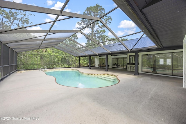 view of pool featuring a patio and glass enclosure