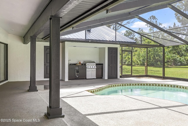 view of pool featuring glass enclosure, area for grilling, and a patio area